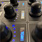 A close-up photo of Hear Back PRO Mixer knobs and digital screens over each knob.